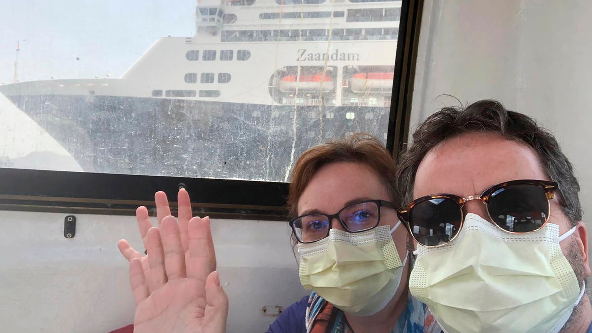 In this March 28 photo, Laura Gabaroni and her husband Juan Huergo take a selfie on board a tender after they were evacuated from the Zaandam, a Holland American cruise ship, near the Panama Canal. (Juan Huergo via AP)