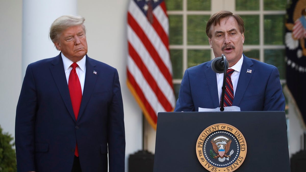 My Pillow CEO Mike Lindell speaks as President Donald Trump listens during a briefing about the coronavirus in the Rose Garden of the White House on Monday. (AP Photo/Alex Brandon)