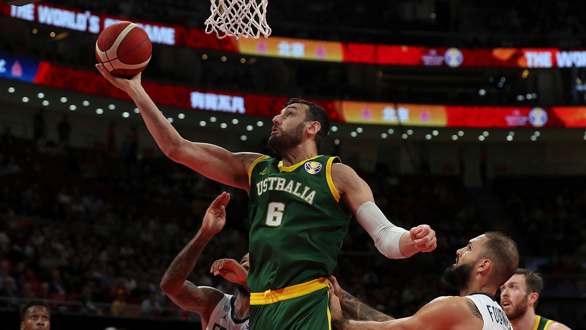 NBA veteran Bogut says players were “used like pawns" in the process that led to his Sydney Kings refusing to fly across the country for Game 4 of the Australian league's finals series because of the coronavirus pandemic, a decision that ultimately handed the championship to Perth. For most people, the new coronavirus causes only mild or moderate symptoms. For some it can cause more severe illness. (AP Photo/Ng Han Guan, File)