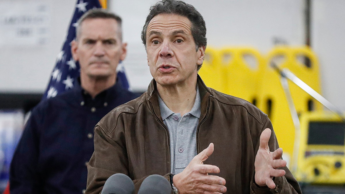New York Gov. Andrew Cuomo speaks during a news conference alongside the National Guard at the Jacob Javits Center that will house a temporary hospital in response to the COVID-19 outbreak, Monday, March 23, 2020, in New York. New York City hospitals are just 10 days from running out of "really basic supplies," Mayor Bill de Blasio said late Sunday. De Blasio has called upon the federal government to boost the city's quickly dwindling supply of protective equipment. The city also faces a potentially deadly dearth of ventilators to treat those infected by the coronavirus. (AP Photo/John Minchillo)