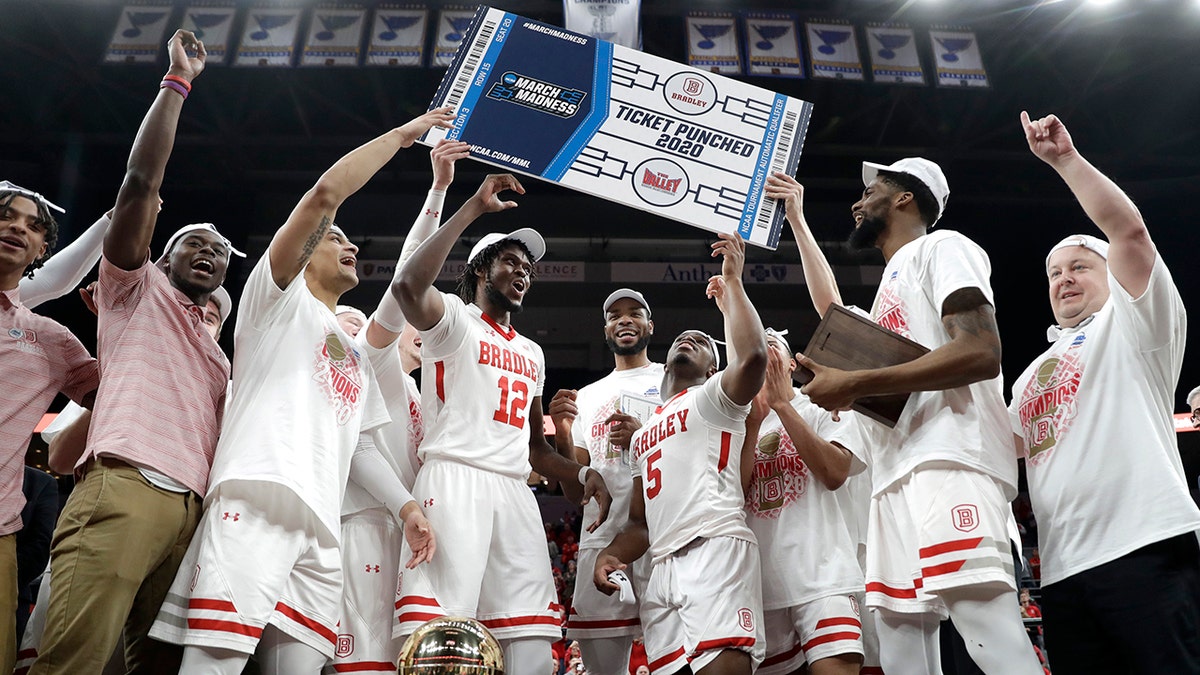 Members of Bradley celebrate after defeating Valparaiso 80-66 during an NCAA college basketball game in the championship of the Missouri Valley Conference men's tournament Sunday, March 8, 2020, in St. Louis. (AP Photo/Jeff Roberson)
