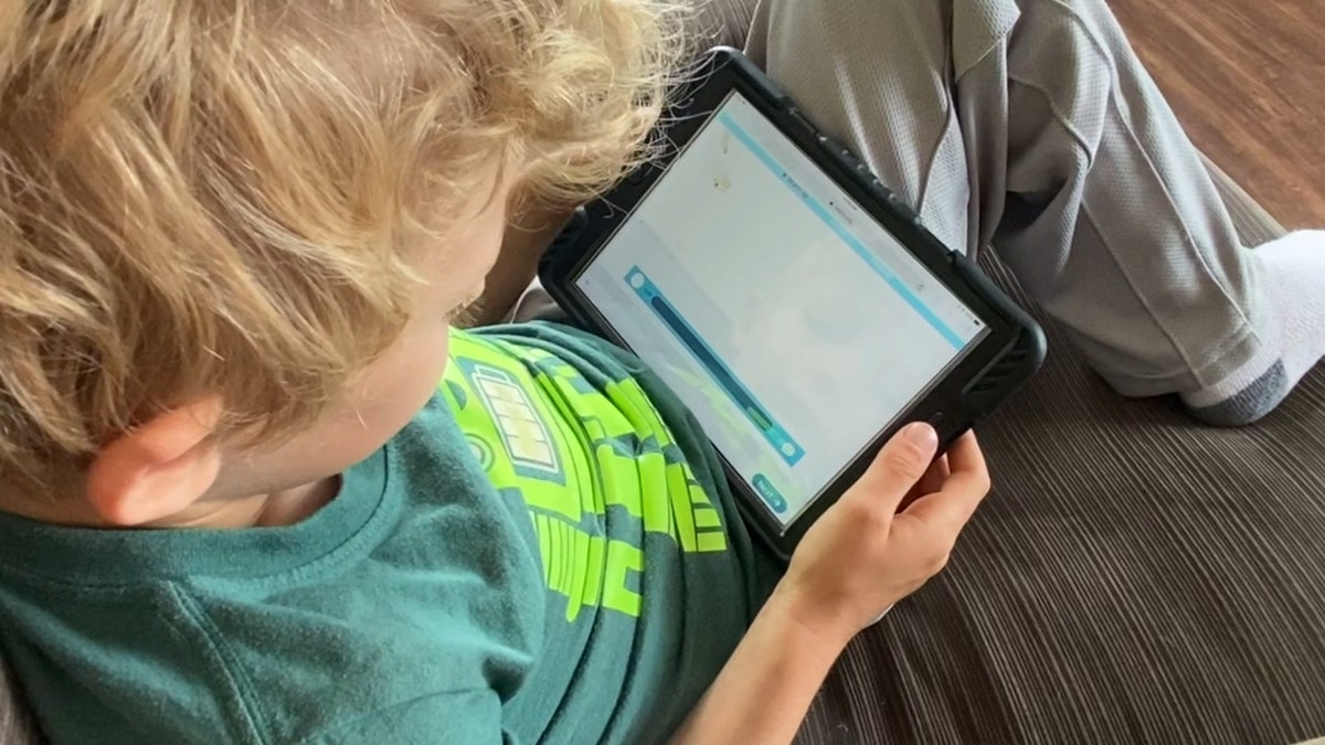 child learning with ipad