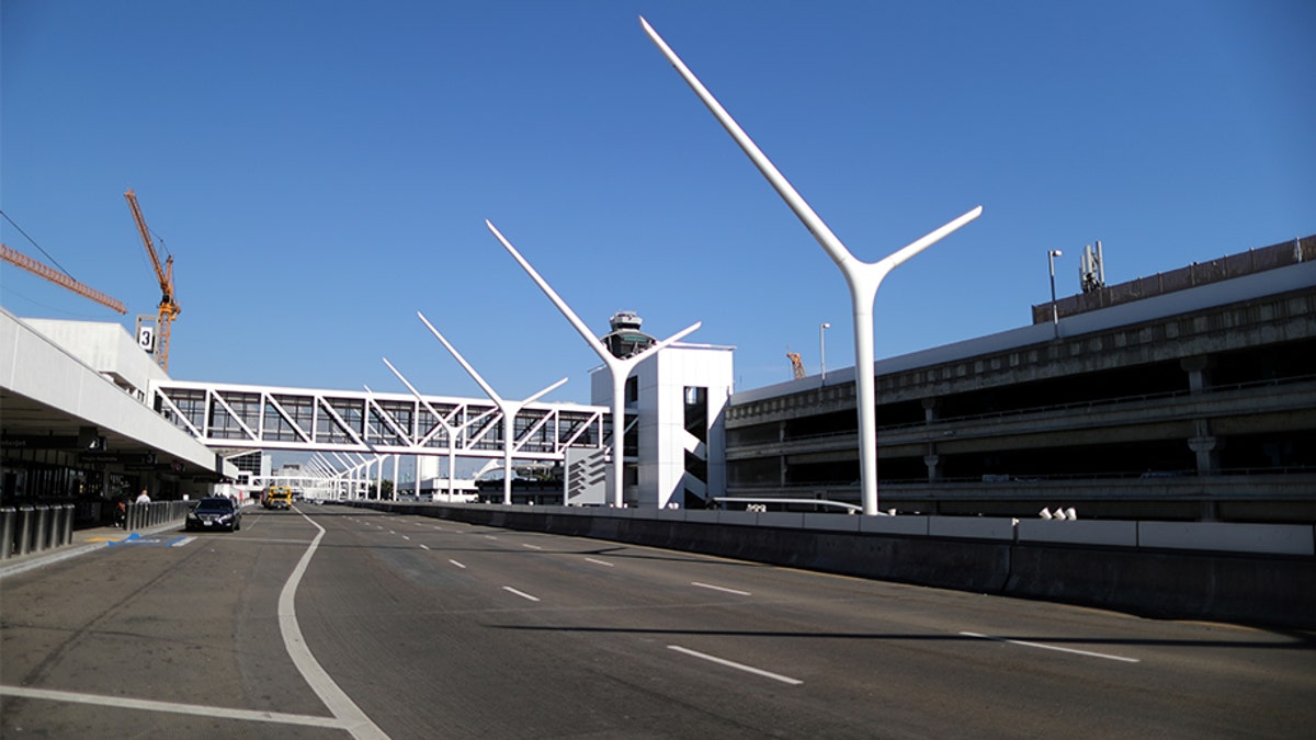 An empty road that runs past terminals is seen at LAX airport in Los Angeles, Calif., amid reports of the coronavirus, March 11, 2020. (REUTERS/Lucy Nicholson)?