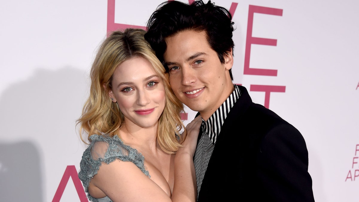 Lili Reinhart (L) and Cole Sprouse (R) arrive at the premiere of CBS Films' "Five Feet Apart" at the Fox Bruin Theatre on March 07, 2019 in Los Angeles, California.