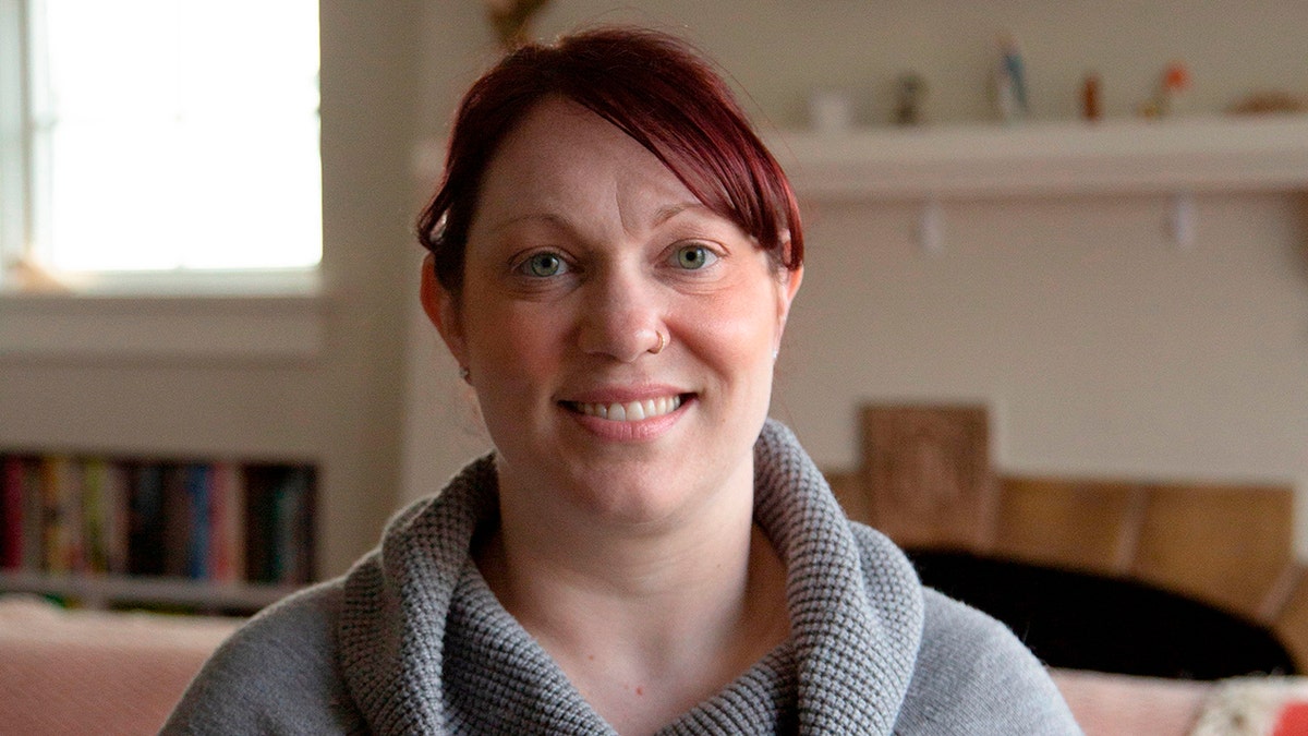 Elizabeth Schneider poses at her house in Seattle, Wash., on March 11, 2020.