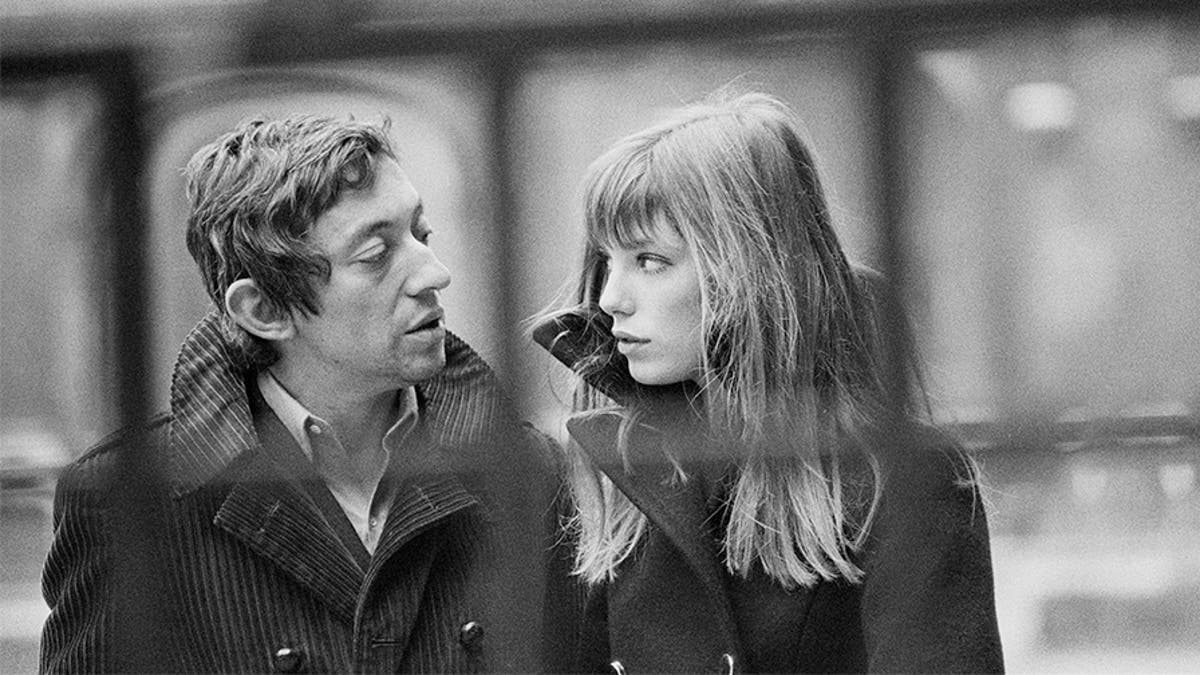 French singer and songwriter Serge Gainsbourg and his partner, British singer and actress Jane Birkin, in the courtyard of the French National College of Fine Arts, in Paris.