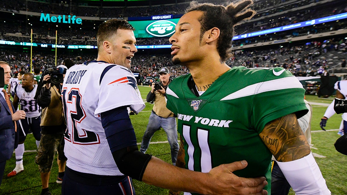 Tom Brady #12 of the New England Patriots shakes hands with Robby Anderson #11 of the New York Jets after his 33-0 win at MetLife Stadium on October 21, 2019 in East Rutherford, New Jersey. (Photo by Steven Ryan/Getty Images)