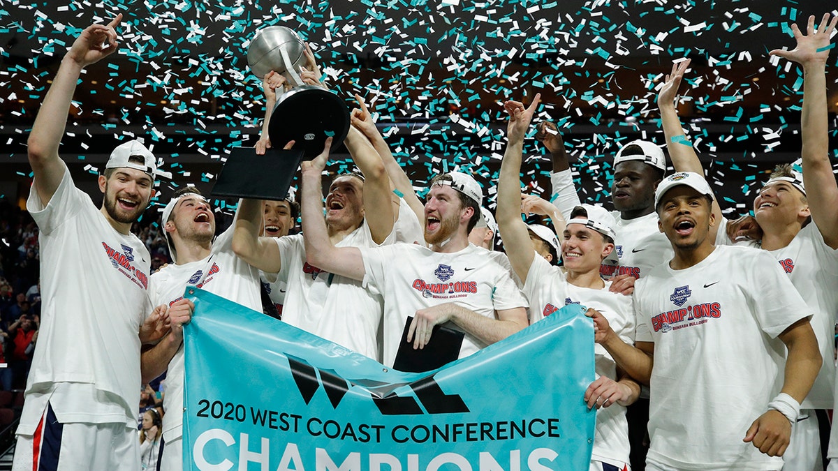 Gonzaga players celebrate after defeating Saint Mary's in an NCAA college basketball game in the final of the West Coast Conference men's tournament Tuesday, March 10, 2020, in Las Vegas. (AP Photo/John Locher)