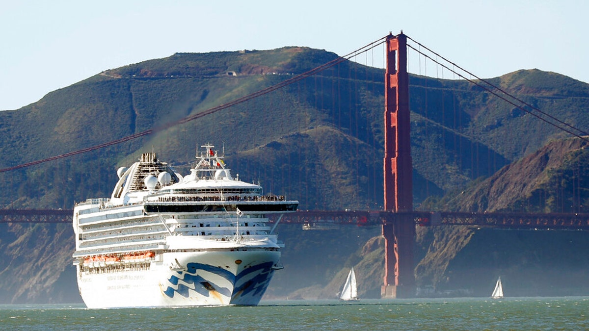 In this Feb. 11, 2020 photo, the Grand Princess cruise ship passes the Golden Gate Bridge as it arrives from Hawaii in San Francisco. (Scott Strazzante/San Francisco Chronicle via AP)