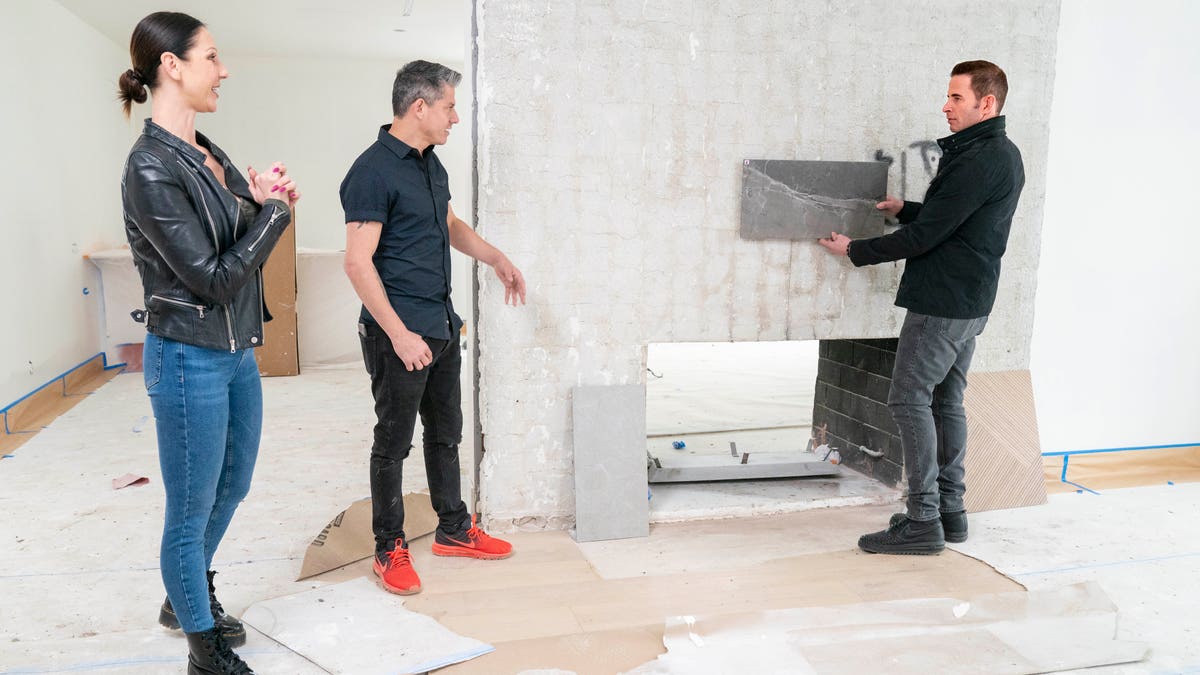 As seen on HGTV’s 'Flipping 101,' host Tarek El Moussa, checks the progress on a house owned by first time home flippers Patricia (L) and Legacy (Center), as he mentors them through the home flipping process.