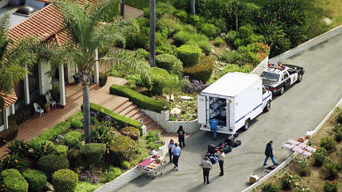 A truck containing some of the bodies of the Heaven's Gate cult, which committed mass suicide, is shown outside the cult's compound in San Diego, Calif. (AP Photo)