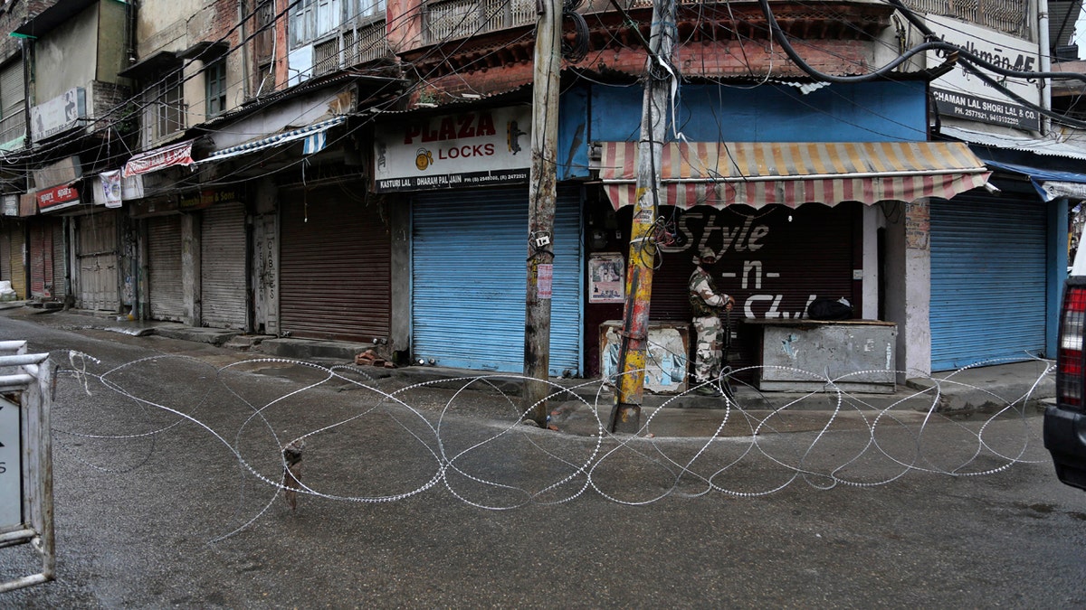 A barbed wire erected by authorities as part of enforcing a lockdown as a precautionary measure against COVID-19 in Jammu, India, Tuesday.