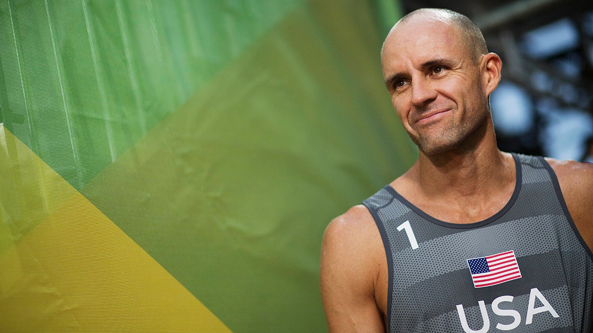 FILE - In this Aug. 8, 2016, file photo, Jake Gibb, of the United States, waits to be introduced to the crowd for a men's beach volleyball match against Austria at the Summer Olympics in Rio de Janeiro, Brazil. Since the spread of coronavirus, high-stakes events in China have been postponed until after the Summer Games or canceled outright; more are in jeopardy, and the five-star World Tour Finals are in Italy, another focus of the outbreak. (AP Photo/David Goldman, File)
