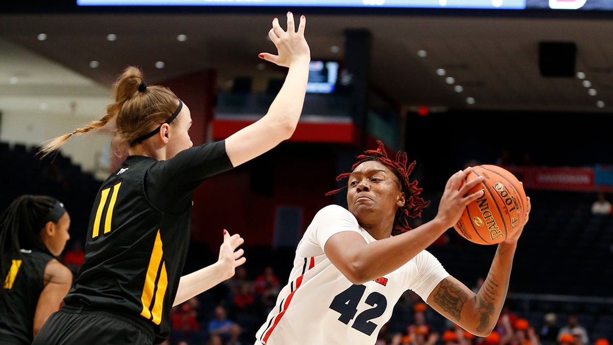 Dayton guard Jayla Scaife (42) is pressured by Virginia Commonwealth forward Kseniya Malashka (11) during the first half of the women's Atlantic 10 championship NCAA college basketball game, Sunday, March 8, 2020, in Dayton, Ohio. (AP Photo/Gary Landers)