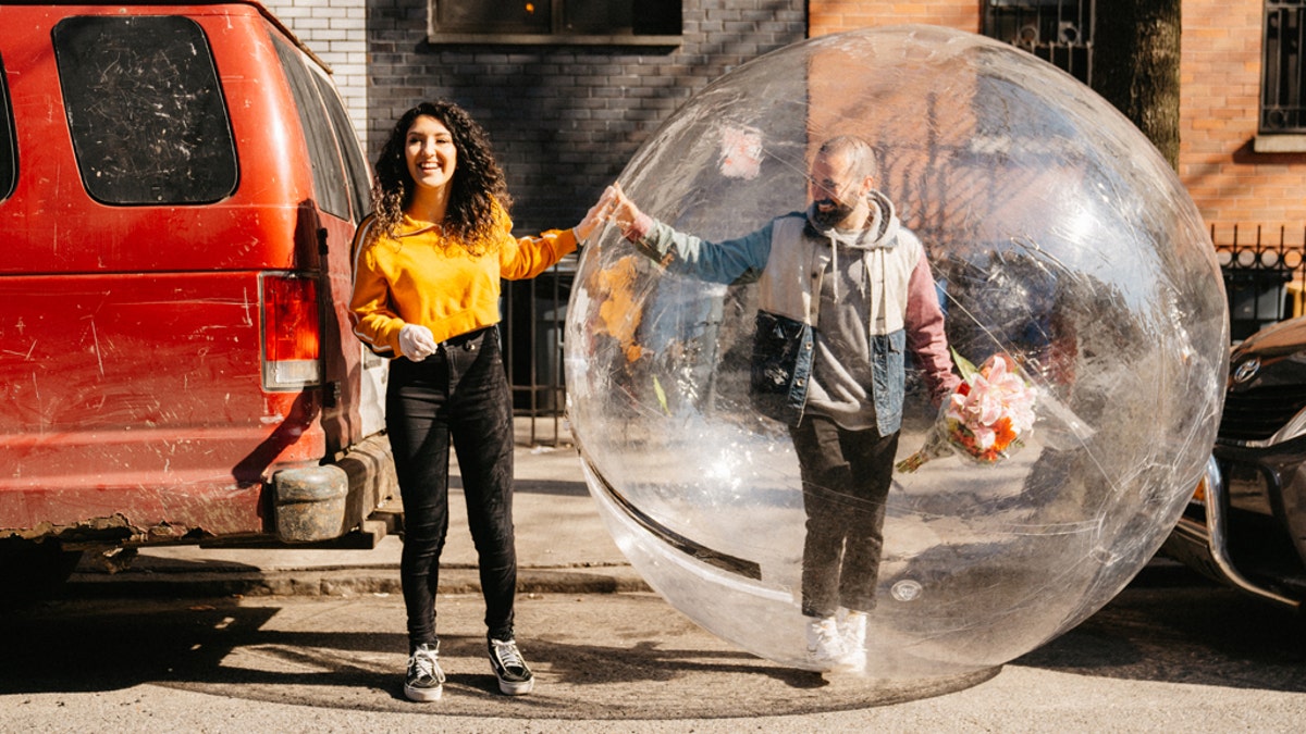 Jeremy Cohen, right, first approached Tori via drone, during self-isolation in their respective Brooklyn residences. Late last week, he donned a bubble so they could hang out in person.
