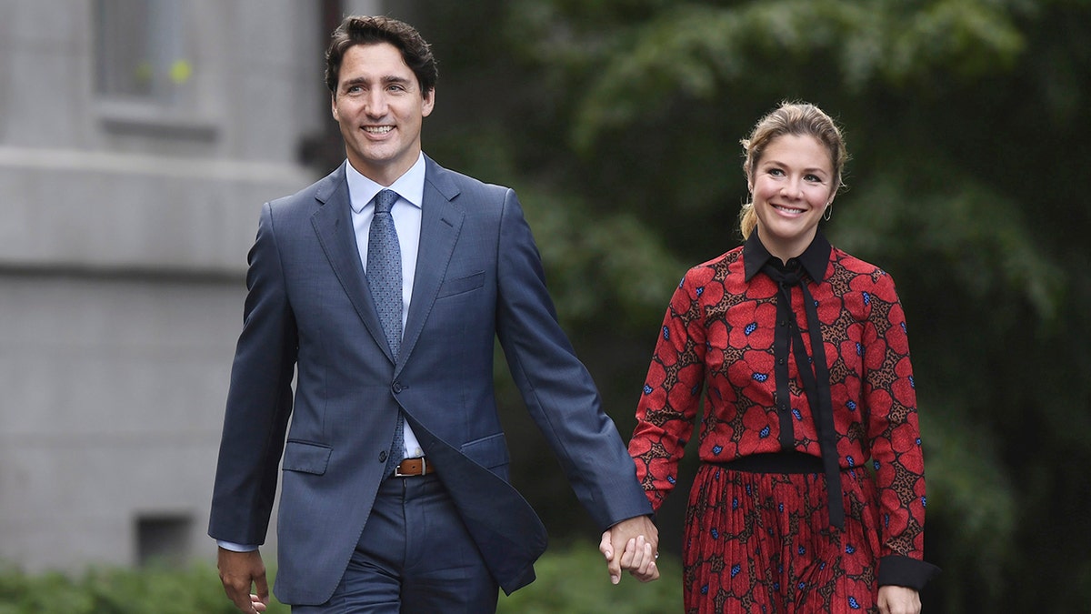 In this Wednesday, Sept. 11, 2019 photo, Canada's Prime Minister Justin Trudeau and his wife Sophie Gregoire Trudeau arrive at Rideau Hall in Ottawa, Ontario. (Justin Tang/The Canadian Press via AP)