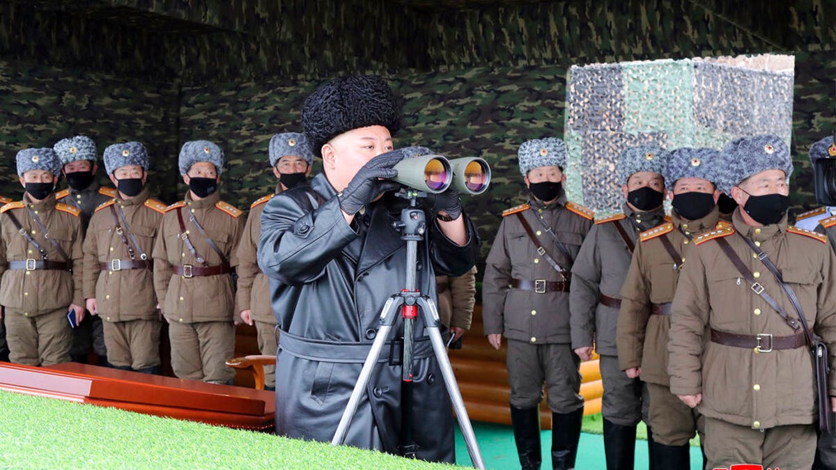 FILE - In this Friday, Feb. 28, 2020, file photo provided on Feb. 29, 2020 by the North Korean government, North Korean leader Kim Jong Un, center, inspects the military drill of units of the Korean People's Army, with soldiers shown wearing face masks. (Korean Central News Agency/Korea News Service via AP, File)