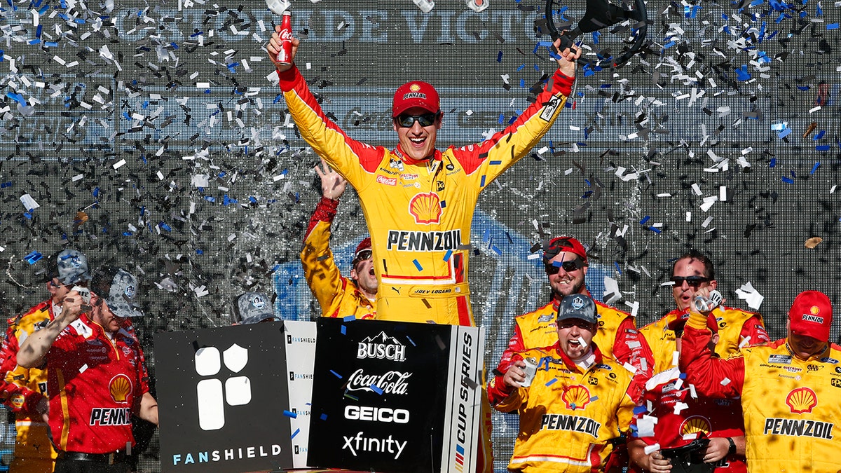 Joey Logano celebrates in Victory Lane after winning a NASCAR Cup Series auto race at Phoenix Raceway, Sunday, March 8, 2020, in Avondale, Ariz. (AP Photo/Ralph Freso)
