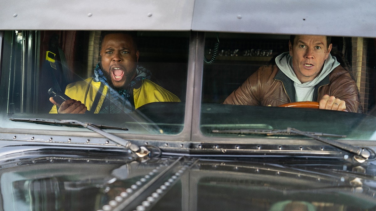 Mark Wahlberg, right, and Winston Duke appear in a scene from 'Spenser Confidential.'