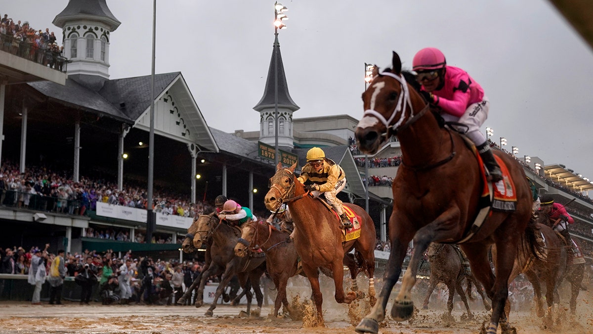 FILE - In this May 4, 2019, file photo, Luis Saez rides Maximum Security, right, across the finish line first against Flavien Prat on Country House during the 145th running of the Kentucky Derby horse race at Churchill Downs in Louisville, Ky. (AP Photo/Matt Slocum, File)