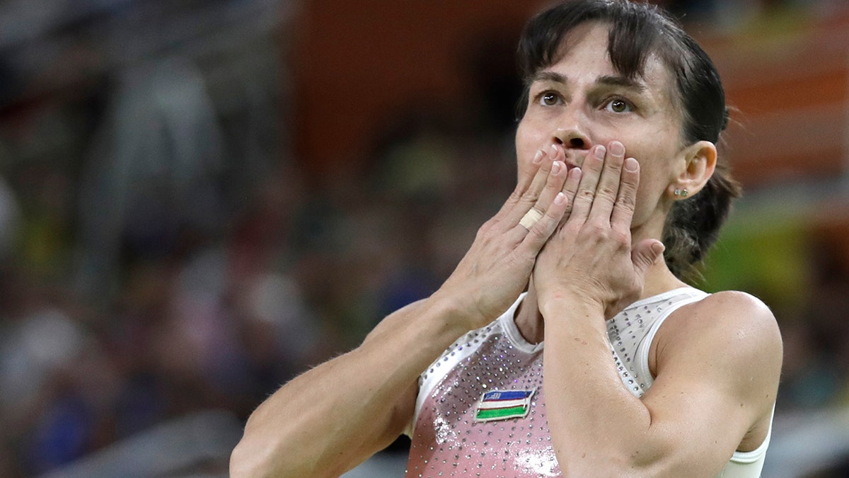 In this Sunday, Aug. 7, 2016 file photo, Uzbekistan's Oksana Chusovitina acknowledges the audience after her routine on the balance beam during the artistic gymnastics women's qualification at the 2016 Summer Olympics in Rio de Janeiro, Brazil. (AP Photo/Rebecca Blackwell, file)