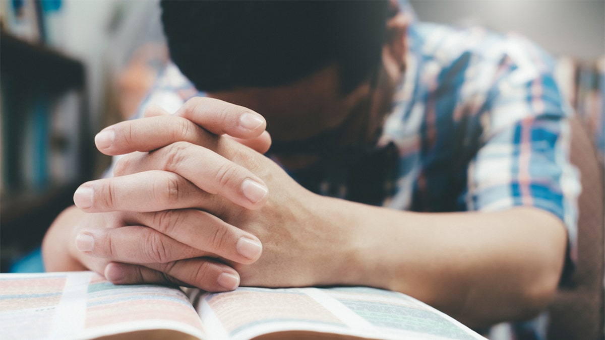 photo of man praying