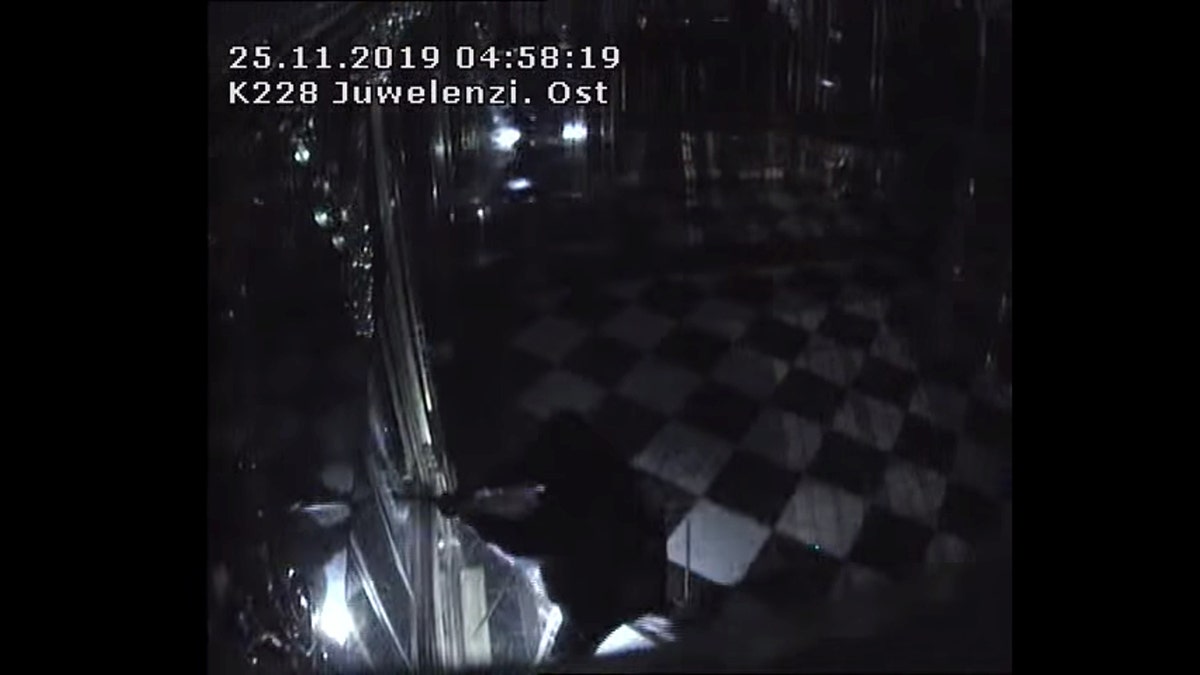 Thieves with torches and tools break into one of the display cabinets in Green Vault museum in Dresden, Germany, November 25, 2019 in this still image taken from a security video. Saxony Police Department/Handout via REUTERS 