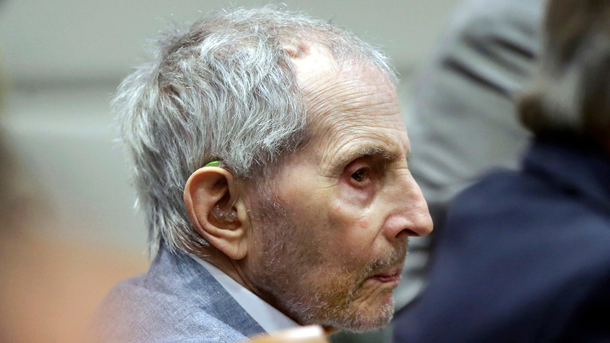 FILE - In this Tuesday, March 10, 2020, file photo, real estate heir Robert Durst listens to his defense attorney give their opening statement during his murder trial in Los Angeles. Durst's trail has been delayed for three weeks over fears of the transmission of coronavirus and will stand adjourned until April 6. (AP Photo/Alex Gallardo, Pool, File)