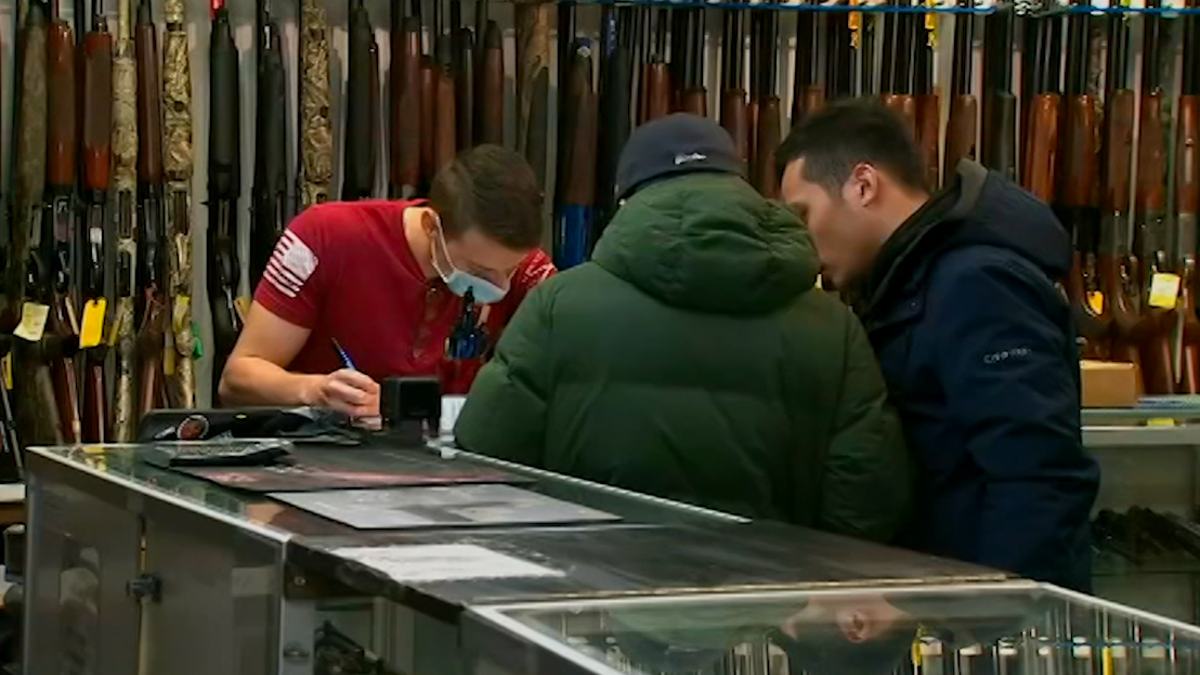Individual completes the necessary paperwork to purchase a firearm.