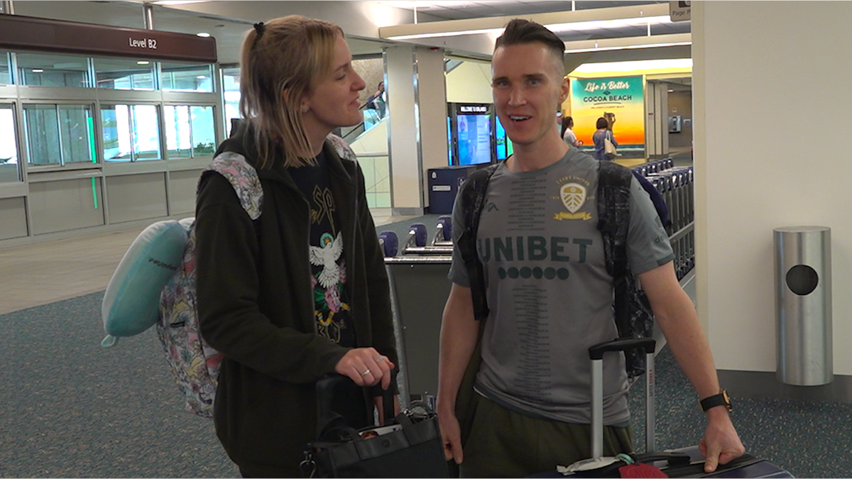 Jack Howarth (right) and his wife, Lucy, arrive at Orlando International Airport for their two-year wedding anniversary (Robert Sherman, Fox News)