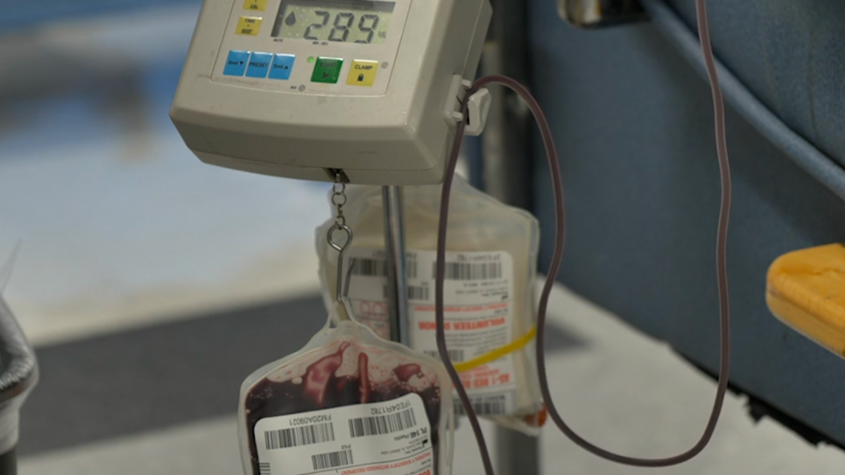 Inside the blood drive, blood is measured after donations are received.