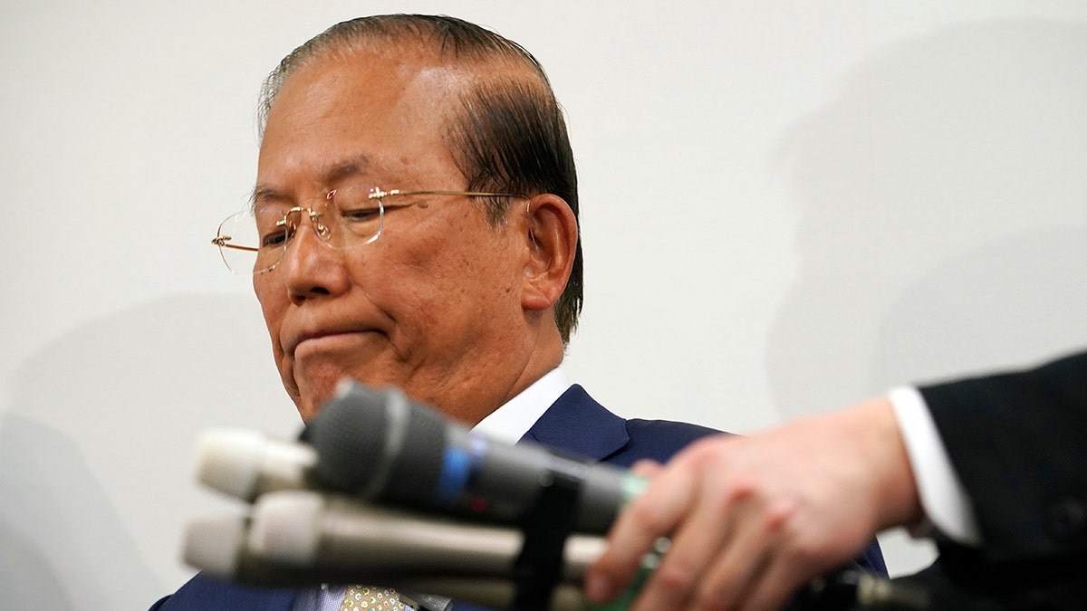 Toshiro Muto, CEO of the Tokyo 2020 Organizing Committee, listens to reporters' questions during a news conference in Tokyo Tuesday, March 17, 2020. (AP Photo/Eugene Hoshiko)