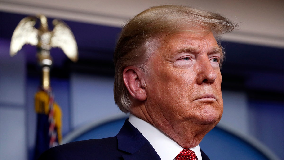 President Donald Trump listens during a briefing about the coronavirus in the James Brady Briefing Room, Wednesday, March 25, 2020, in Washington. (AP Photo/Alex Brandon)