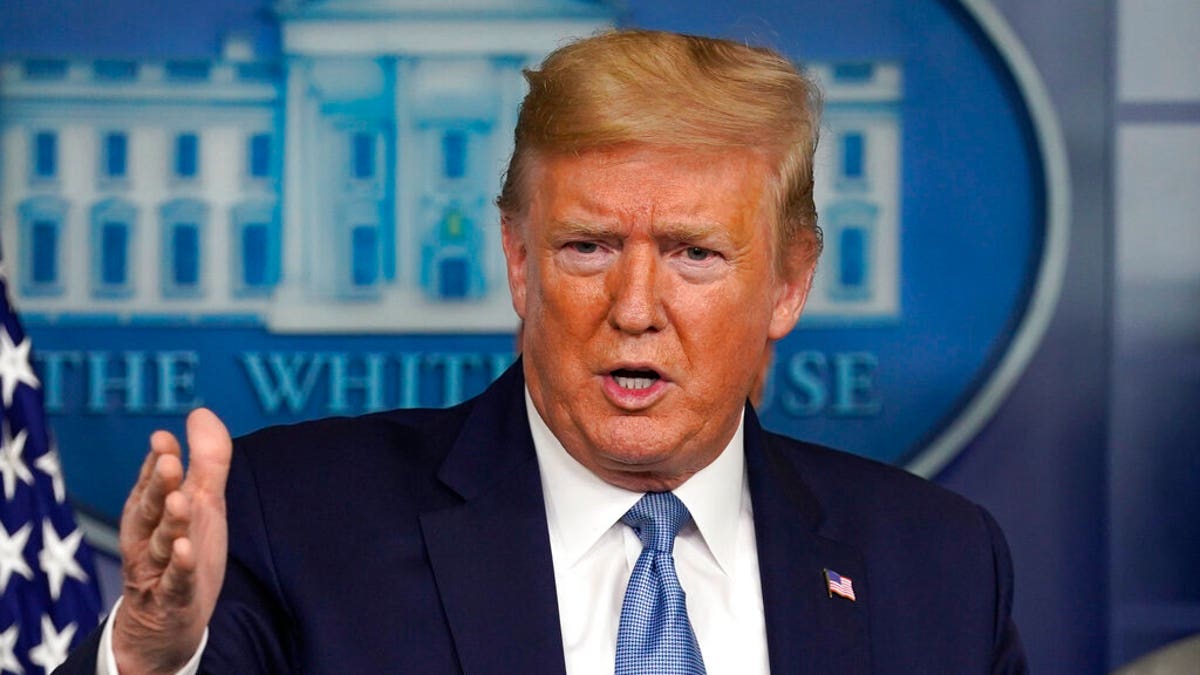 President Donald Trump speaks during a press briefing wearing a suit and tie in the James Brady Press room