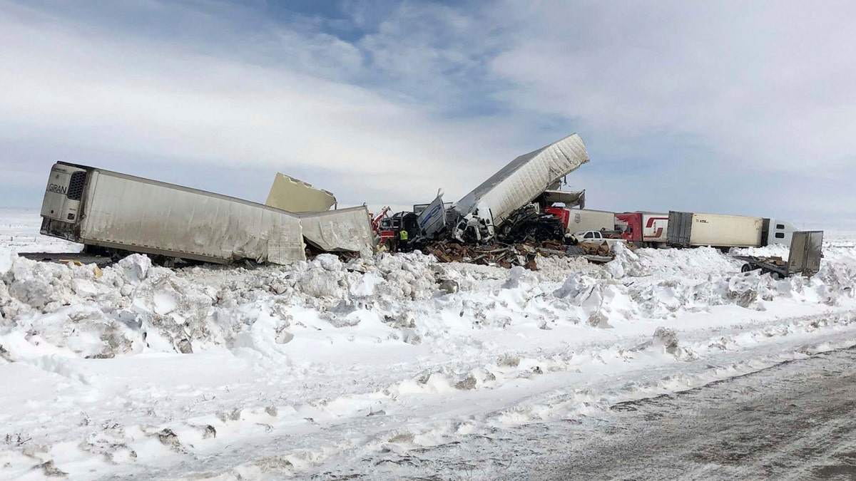 Wrecked tractor-trailers remain on the scene Monday, March 2, 2020, following Sunday's accident, on Interstate 80 in south central Wyoming.