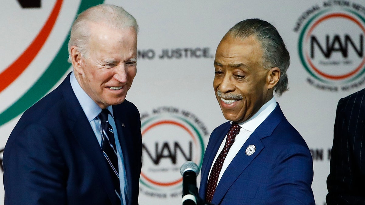 The Rev. Al Sharpton, right, introduces Democratic presidential candidate former Vice President Joe Biden at the National Action Network South Carolina Ministers' Breakfast, Wednesday, Feb. 26, 2020, in North Charleston, S.C. (AP Photo/Matt Rourke)