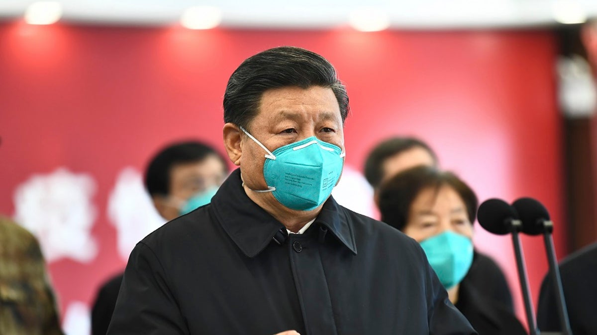 In this photo released by China's Xinhua News Agency, Chinese President Xi Jinping talks by video with patients and medical workers at the Huoshenshan Hospital in Wuhan in central China's Hubei Province earlier this month. China said Thursday that no new coronavirus cases were reported in Wuhan, the epicenter of the pandemic. (Xie Huanchi/Xinhua via AP)