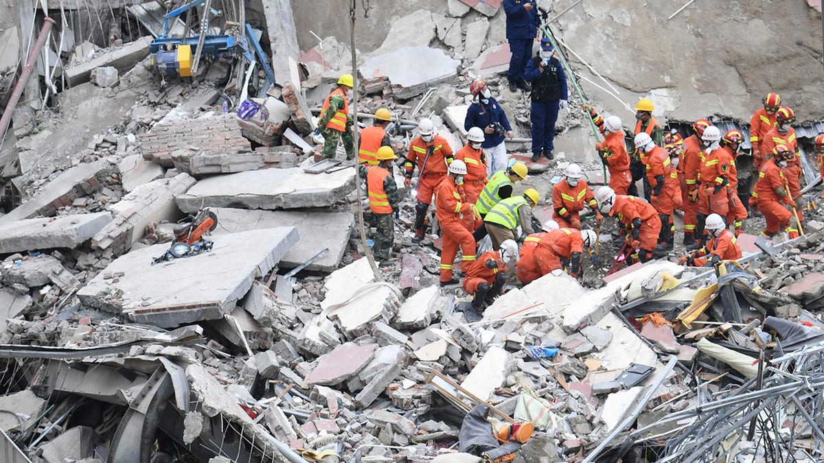 The death toll increased to 20 on Tuesday, with 10 still missing, as rescuers continue searching the rubble. (Lin Shanchuan/Xinhua via AP)