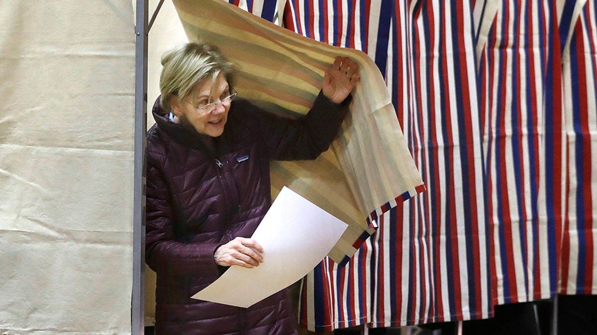 Democratic presidential candidate Sen. Elizabeth Warren, D-Mass., emerges from the booth with her ballot as she votes on Tuesday, March 3, 2020, in Cambridge, Mass. (AP Photo/Steven Senne)
