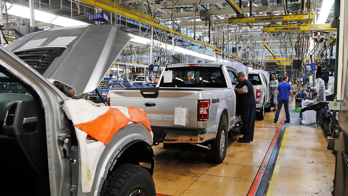 United Auto Workers assembly workers assemble 2018 Ford F-150 trucks at the Ford Rouge assembly plant in Dearborn, Mich., Sept. 27, 2018. (Associated Press)
