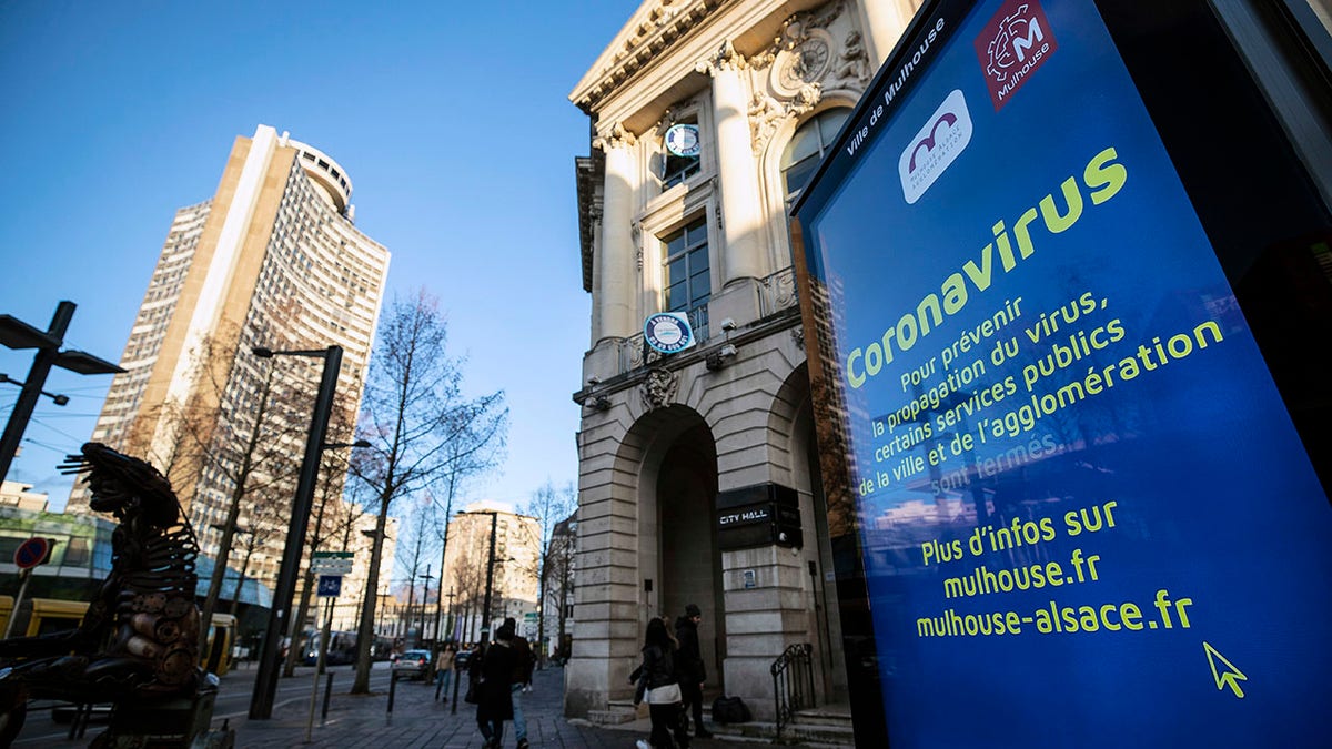 A general view of signs about coronavirus in the city of Mulhouse, eastern France, on Monday. (AP Photo/Jean-Francois Badias)