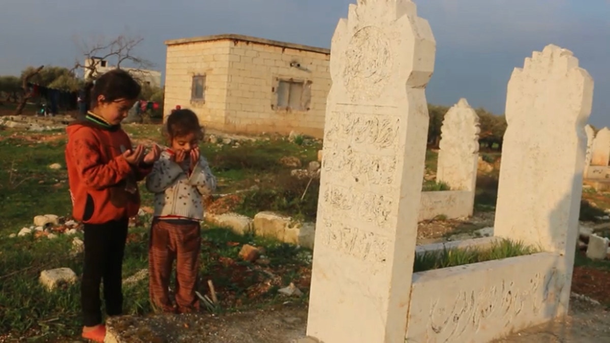 A family lives in a graveyard in Idlib, the last rebel stronghold in the Syrian Civil War