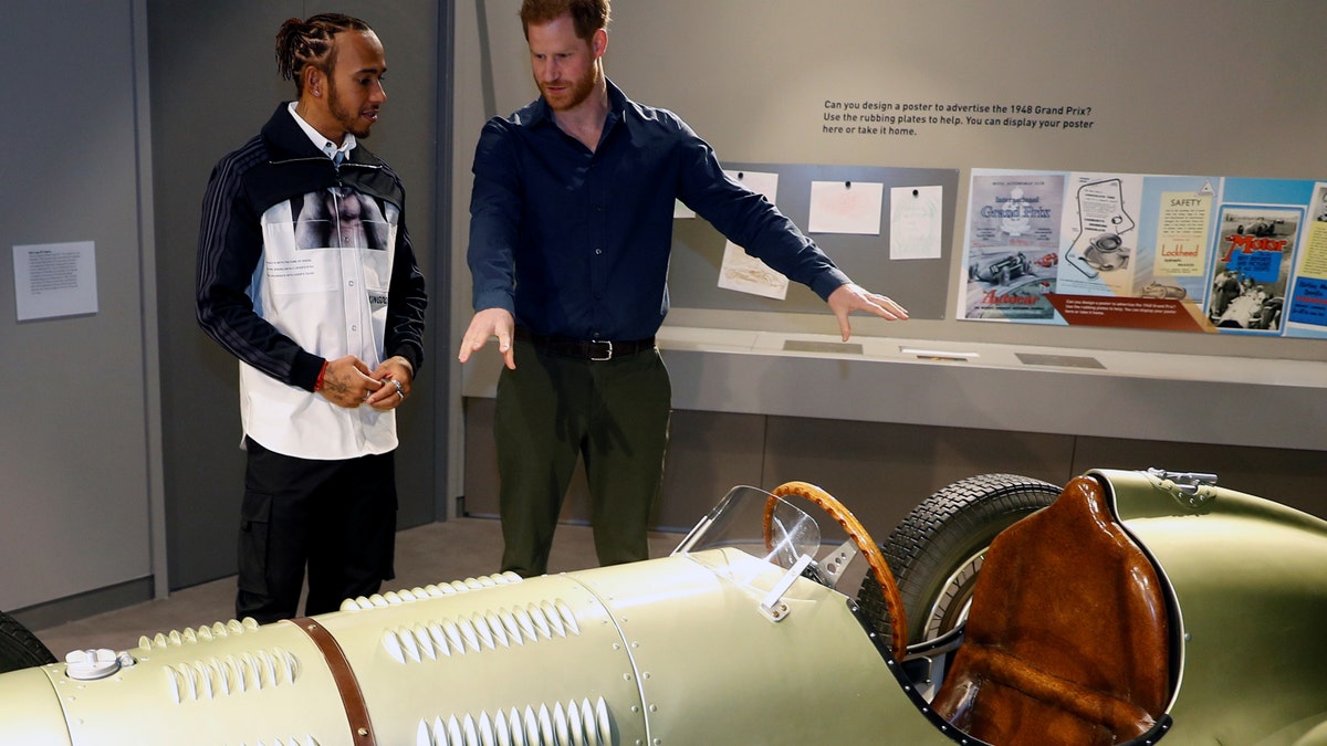 Prince Harry, Duke of Sussex speaks with Formula One World Champion Lewis Hamilton as he officially opens The Silverstone Experience at Silverstone on March 6.