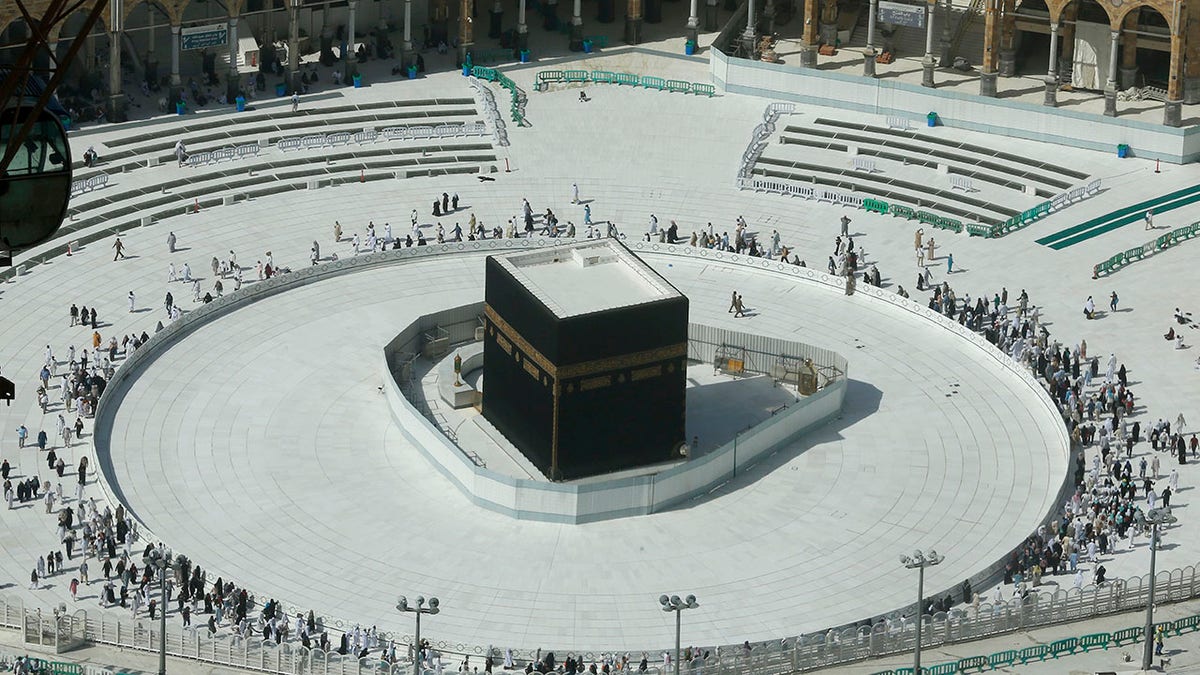 Few worshippers were allowed to enter the Grand Mosque in Mecca after dawn prayers on Saturday to circumambulate the Kaaba over fears of coronavirus. (AP Photo/Amr Nabil)