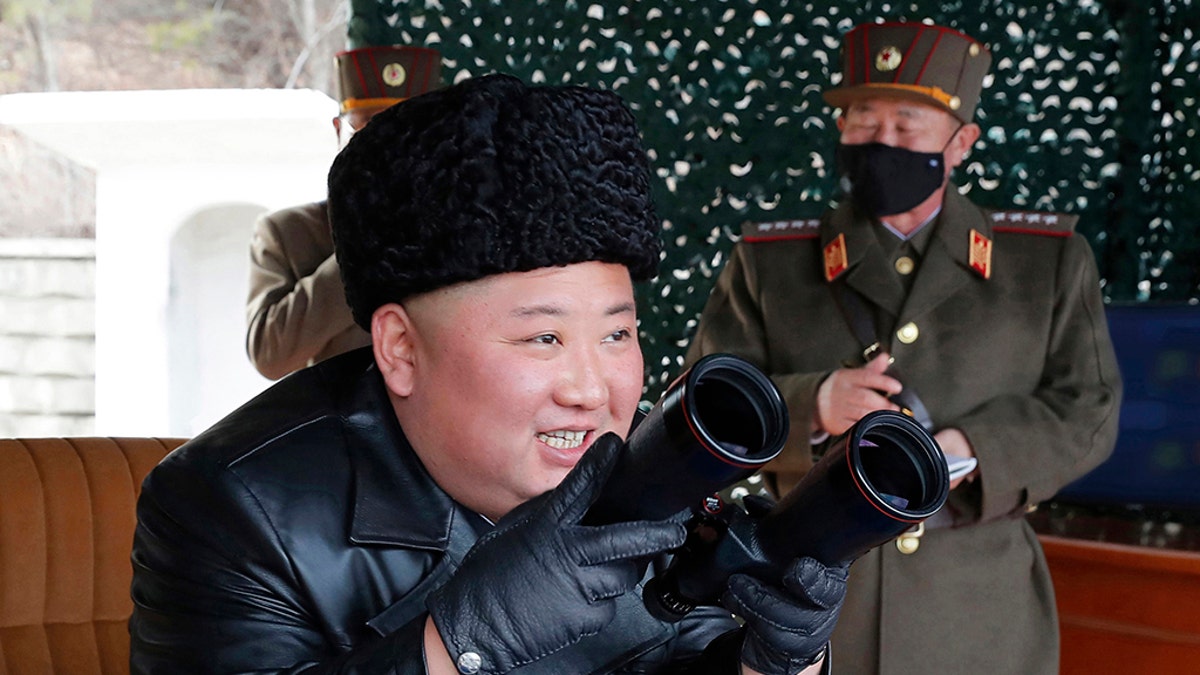 In this photo provided by the North Korean government, North Korean leader Kim Jong Un inspects a military drill at undisclosed location in North Korea on Monday, March 2, 2020. Independent journalists were not given access to cover the event depicted in this image distributed by the North Korean government. The content of this image is as provided and cannot be independently verified. Korean language watermark on image as provided by source reads: "KCNA" which is the abbreviation for Korean Central News Agency. (Korean Central News Agency/Korea News Service via AP)