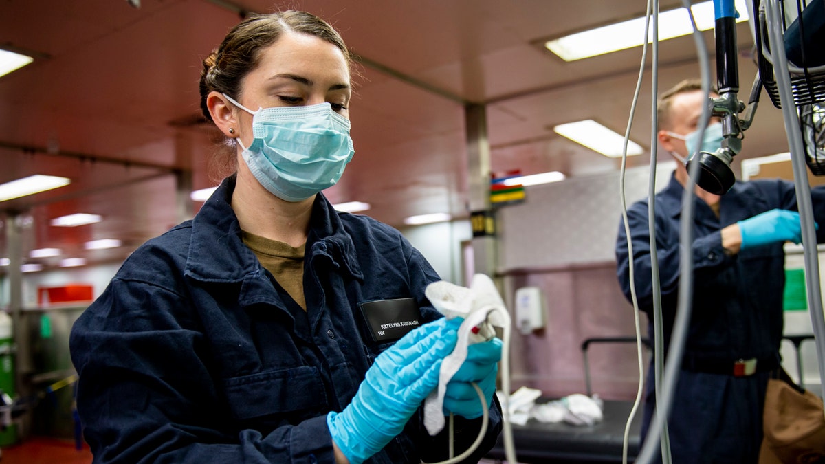 Katelynn Kavanagh, from Temecula, Calif., sanitizes medical equipment aboard the USNS Mercy. Mercy deployed in support of the nation's COVID-19 response efforts, and will serve as a referral hospital for non-COVID-19 patients currently admitted to shore-based hospitals in Los Angeles.
