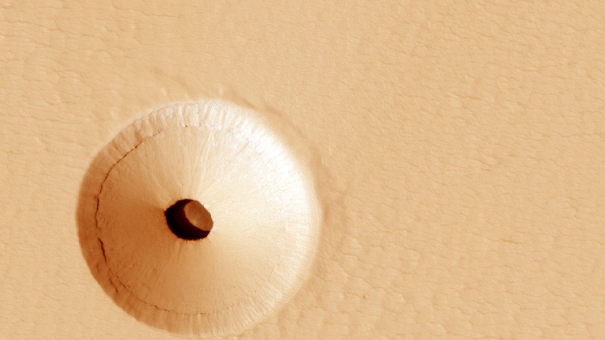 A Hole in Mars (Credit: NASA, JPL, U. Arizona)