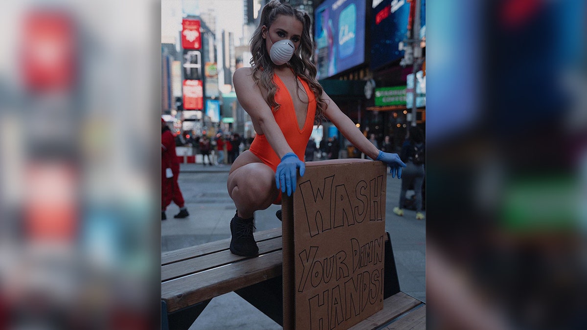The model and host took to NYC's Time Square with her hygiene PSA.
