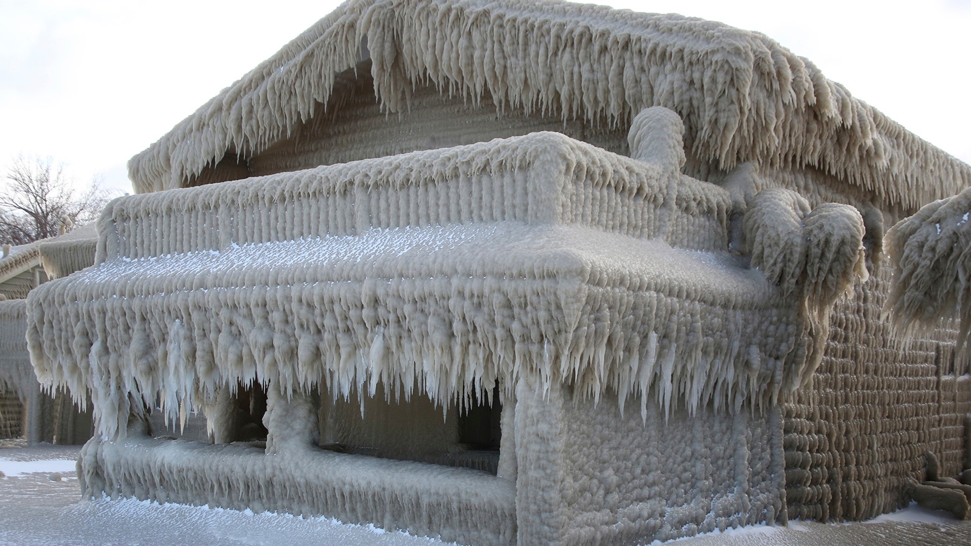 Houses along Hoover Beach are covered by ice from high winds and waves from Lake Erie in Hamburg, New York, Feb. 29, 2020.