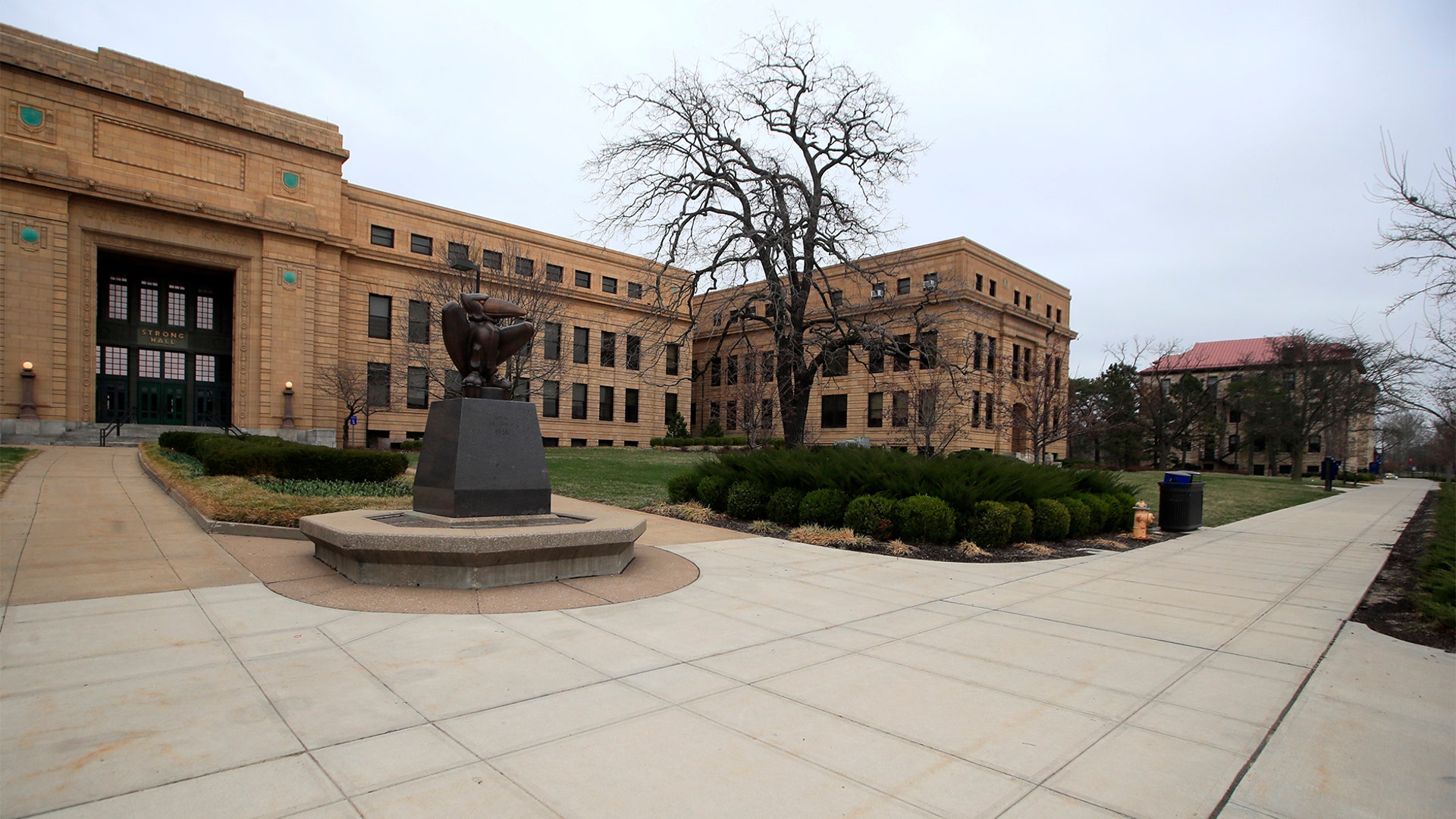 Sidewalks are empty around Strong Hall in the middle of the University of Kansas campus In Lawrence, Kan., Mar. 17, 2020.